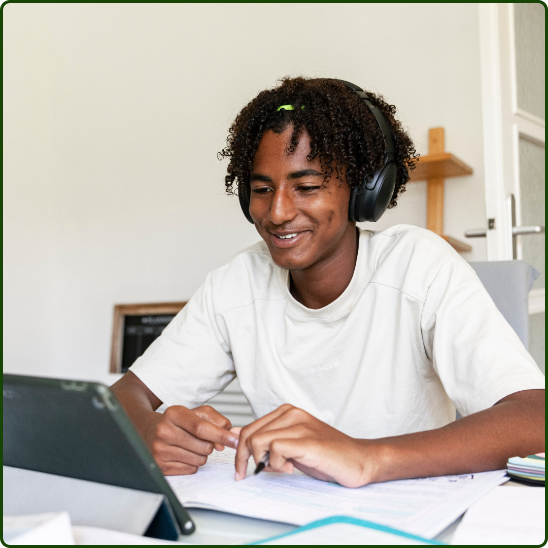 photo of young person on computer