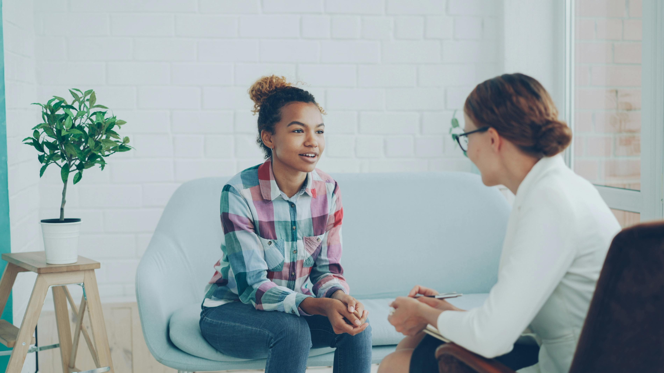 image of an adult talking to a young person