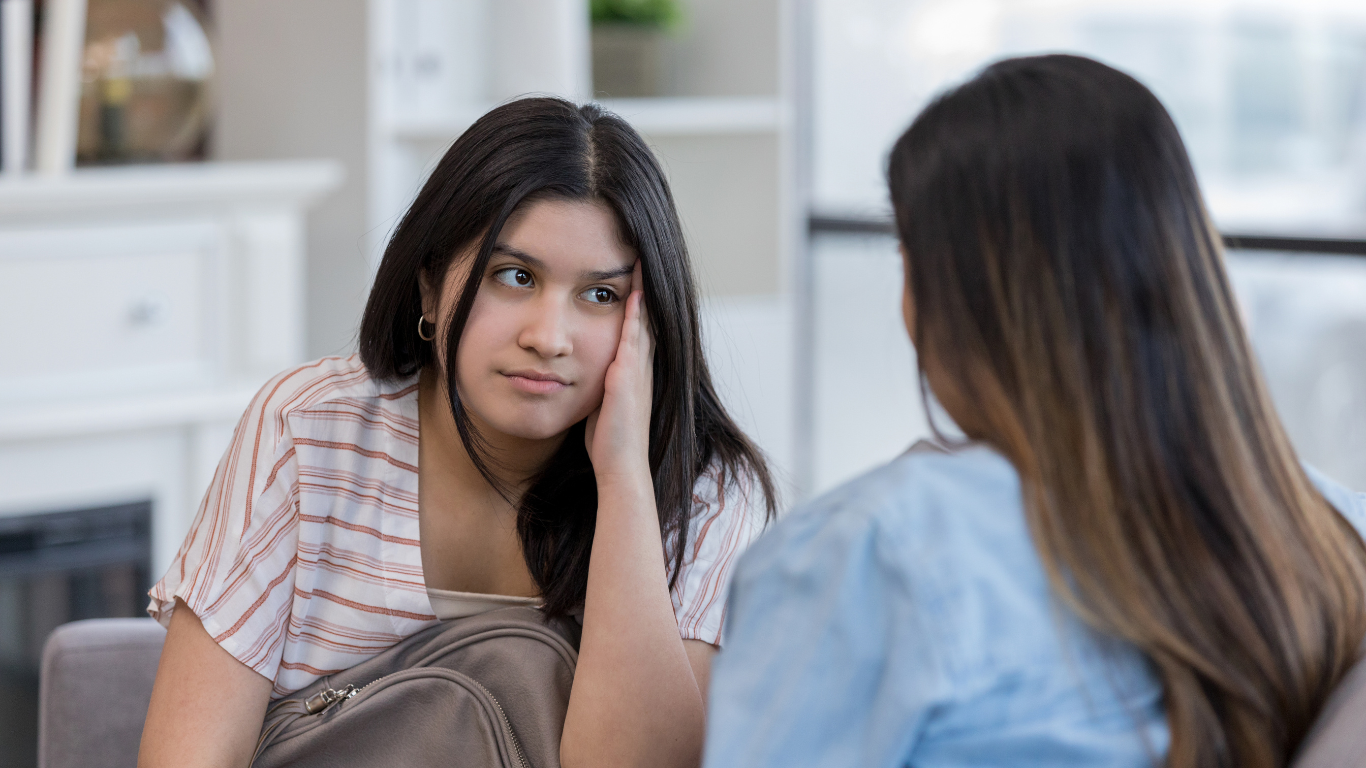 image of a young person looking at an adult