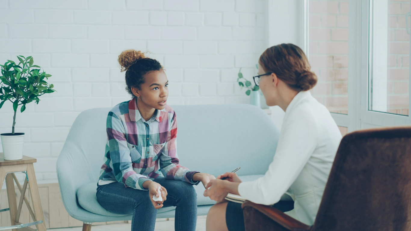 young person talking to adult
